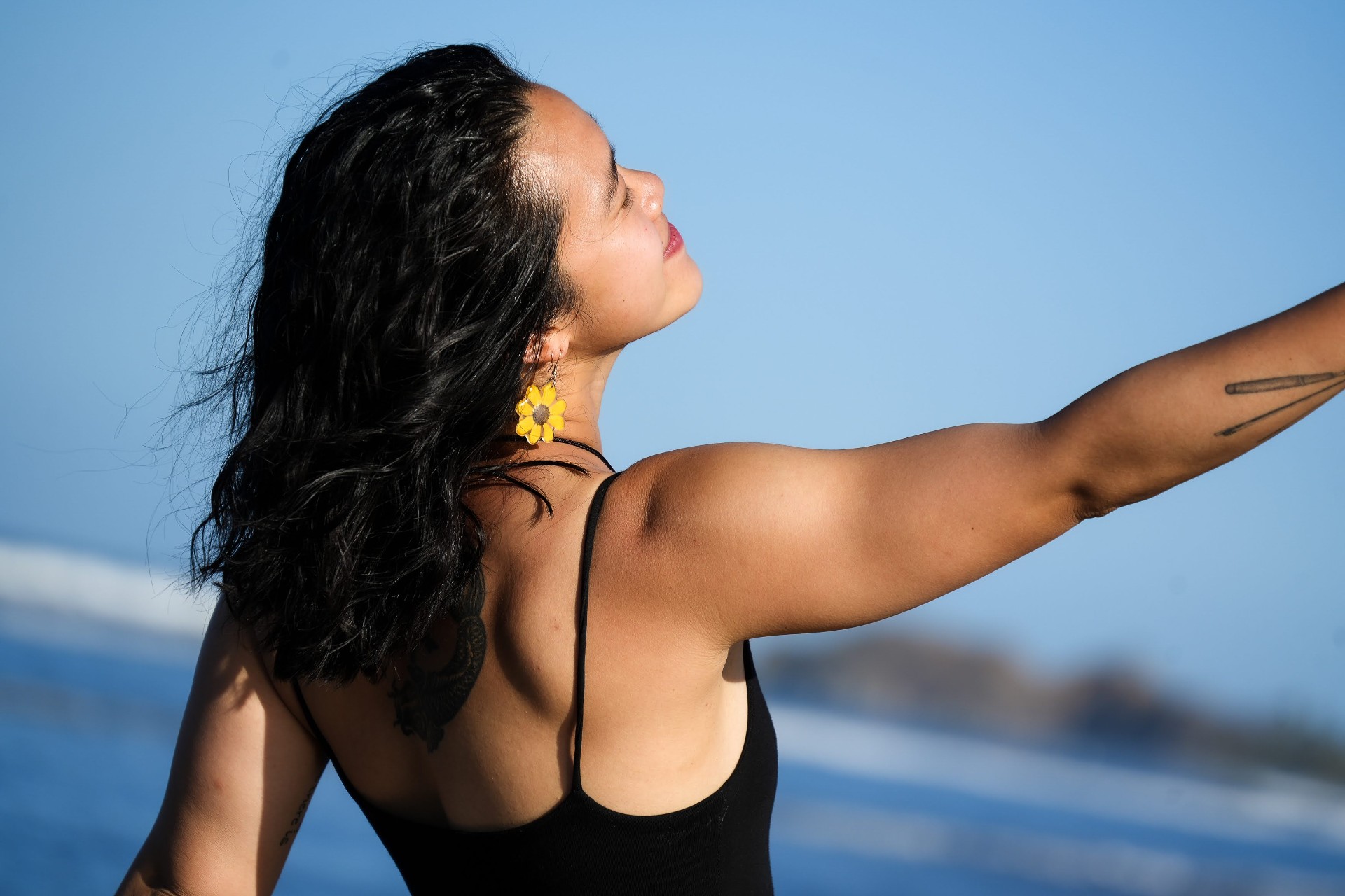 Lee Ann practicing yoga at the beach at sunrise